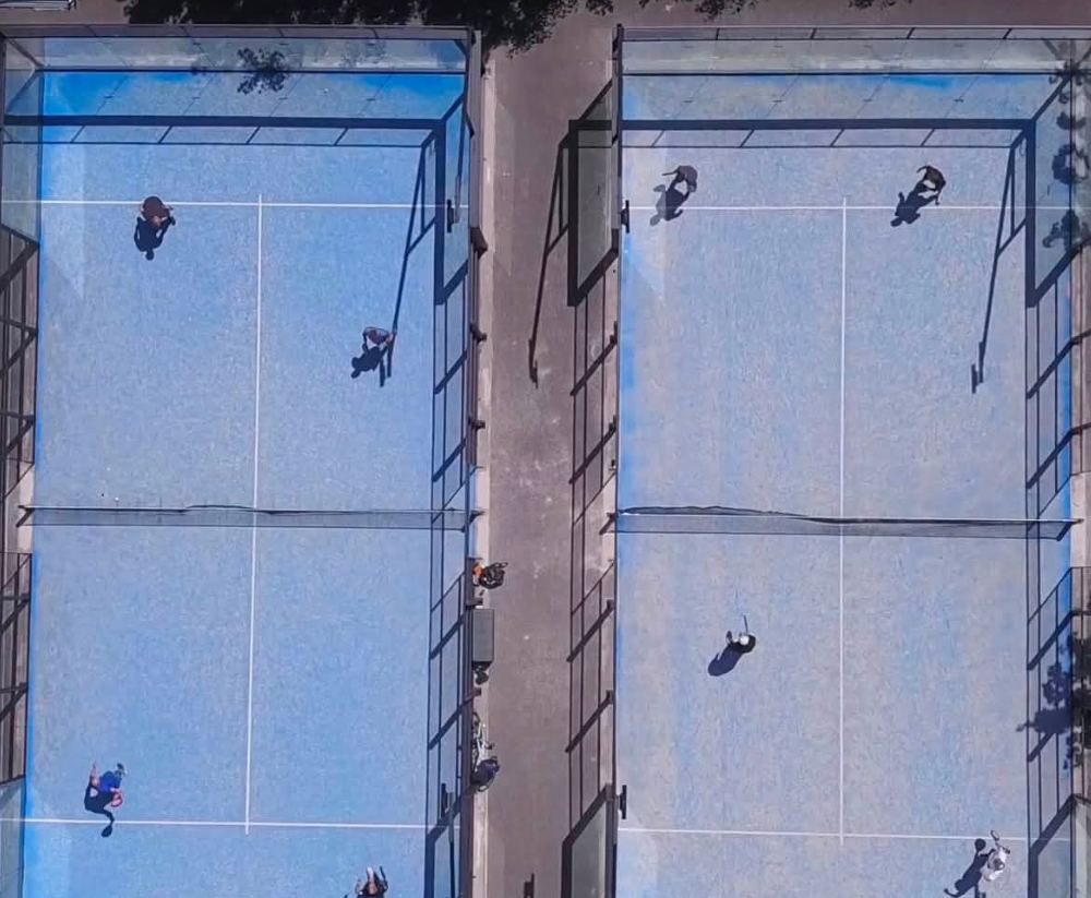 Aerial view of the two padel courts in play